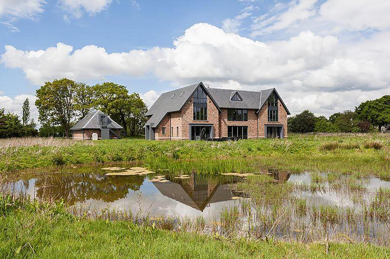  The plush new mansion comes complete with a wildlife pond and paddock
