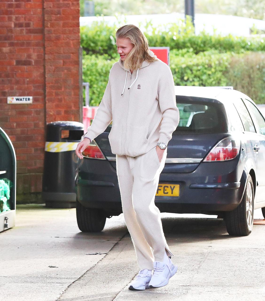 Haaland let his hair down physically and mentally as he stepped out in a casual cream tracksuit