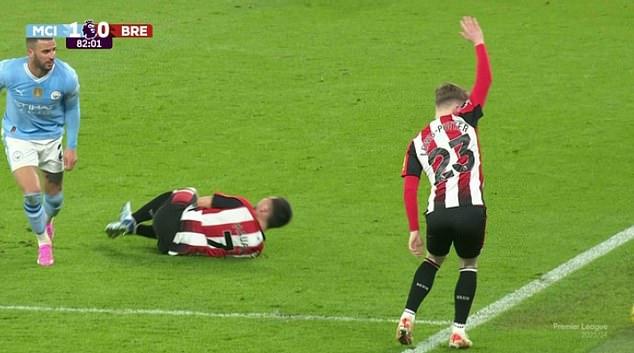 Maupay lay on the pitch in agony after bearing the brunt of a heavy challenge from Walker