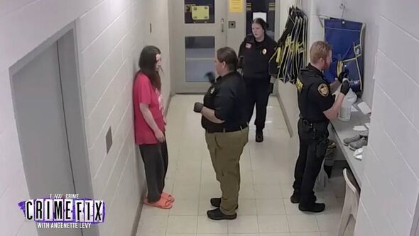 The woman was the only one of the four not placed in handcuffs