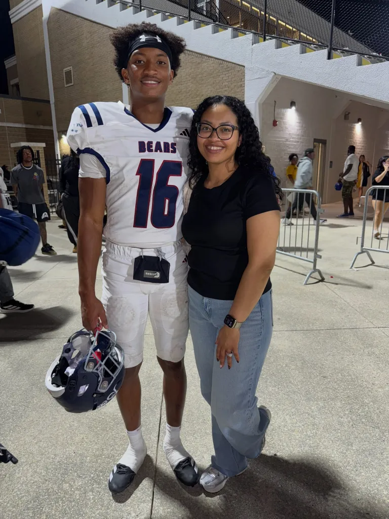 Nolan Wells in his football uniform and his mother Christine Wonsley.