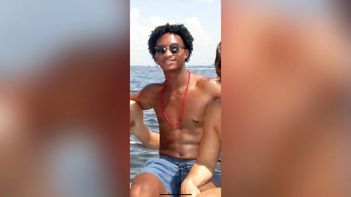 Nolan Wells smiling with sunglasses.