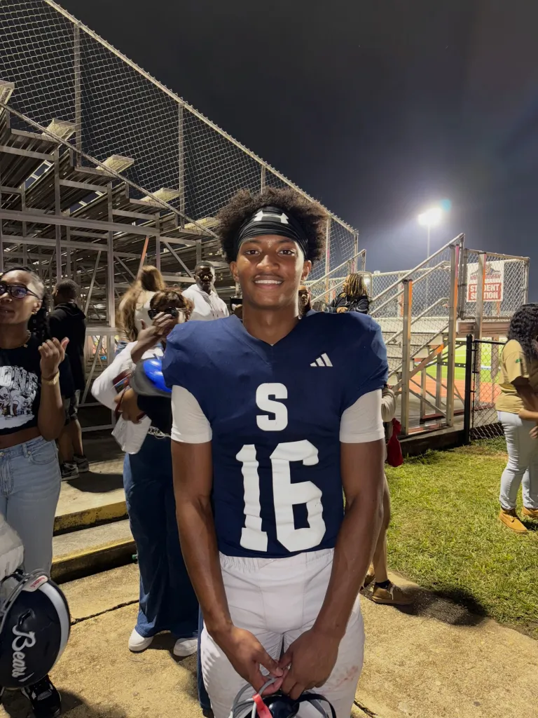 Nolan Wells in his football uniform on a field.