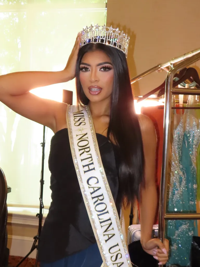 Brittany Boltinhouse, ex-Miss North Carolina USA, posing with her crown and sash.