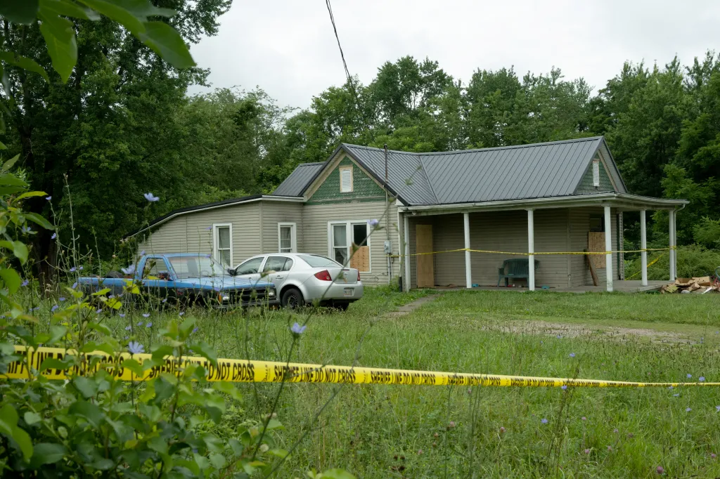 The Sider’s home at 82 Ohmer St. in Hamden, Ohio, with yellow police tape across the foreground.