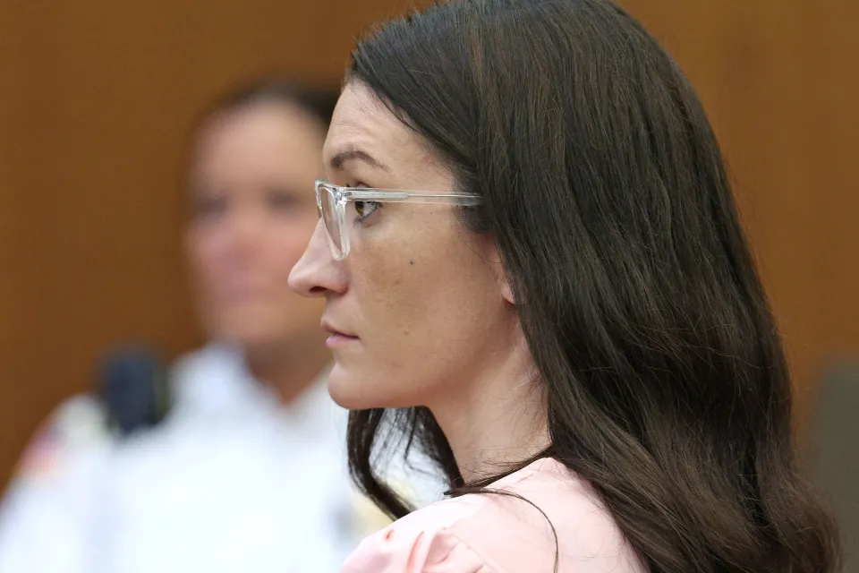 Defendant Lindsay Clancy listens to Dr. Jennifer Tufts at her murder trial.