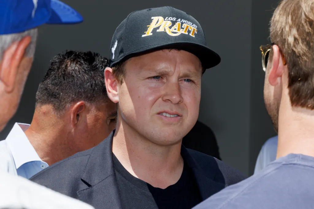 LA mayoral candidate Spencer Pratt wears a black cap with "LOS ANGELES PRATT" on it, engaging with attendees at a meet and greet event.