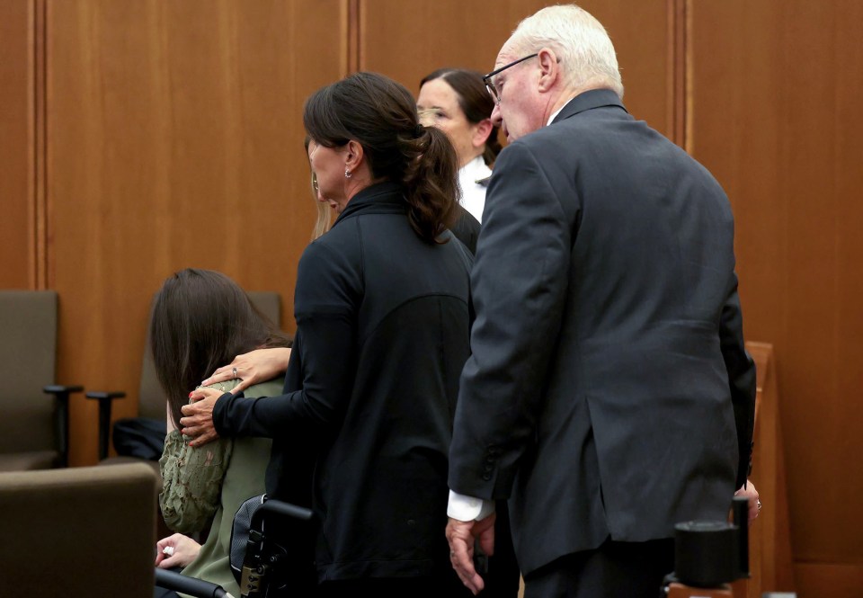 Defense attorney Kevin Reddington and Lindsay Clancy's caretakers wheel Clancy out of the courtroom during her murder trial.