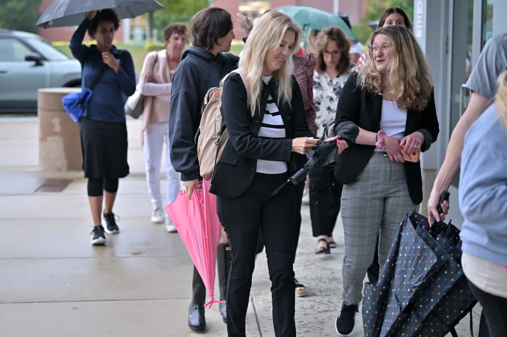 A line of supporters of Lindsay Clancy enters Plymouth Superior Court on Friday, Aug. 21, 2026, in Plymouth, Mass.