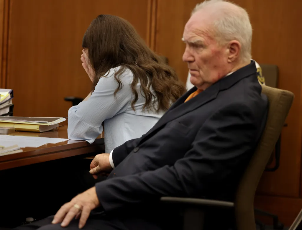 Defense attorney Kevin Reddington and Lindsay Clancy listen to a 911 recording during Clancy's murder trial.