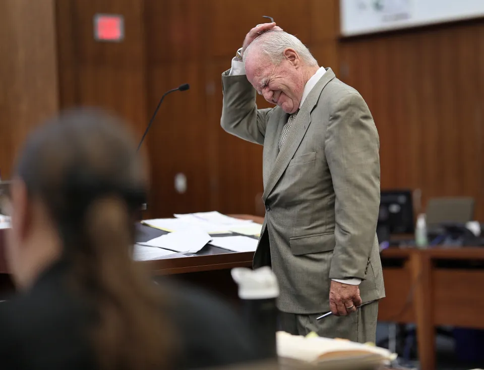 Defense attorney Kevin Reddington expressing frustration during a cross-examination in court.