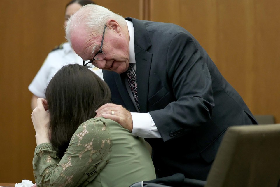 Defense attorney Kevin Reddington consoles a sobbing Lindsay Clancy during her murder trial.