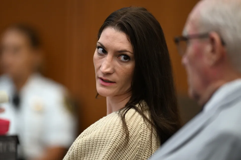 Lindsay Clancy looking towards the camera during her murder trial.