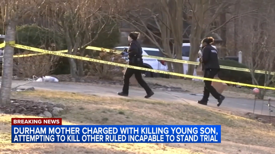 Police tape and officers investigate a crime scene at a home, with a news chyron reporting on a Durham mother charged with killing her son.