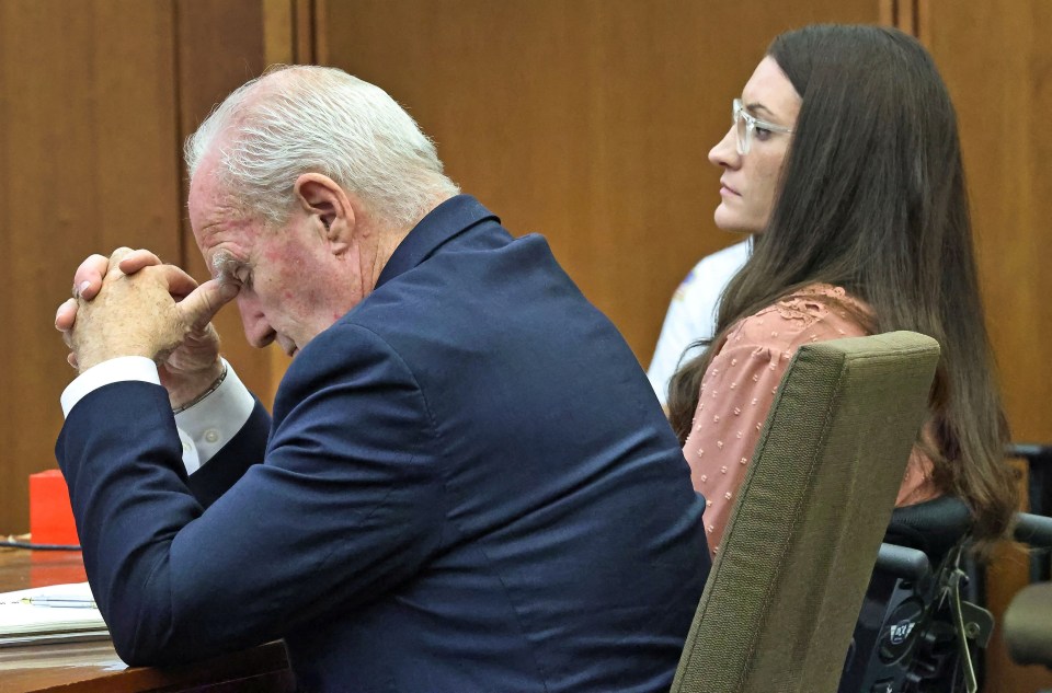 Defense attorney Kevin Reddington listens to testimony next to his client, Lindsay Clancy.