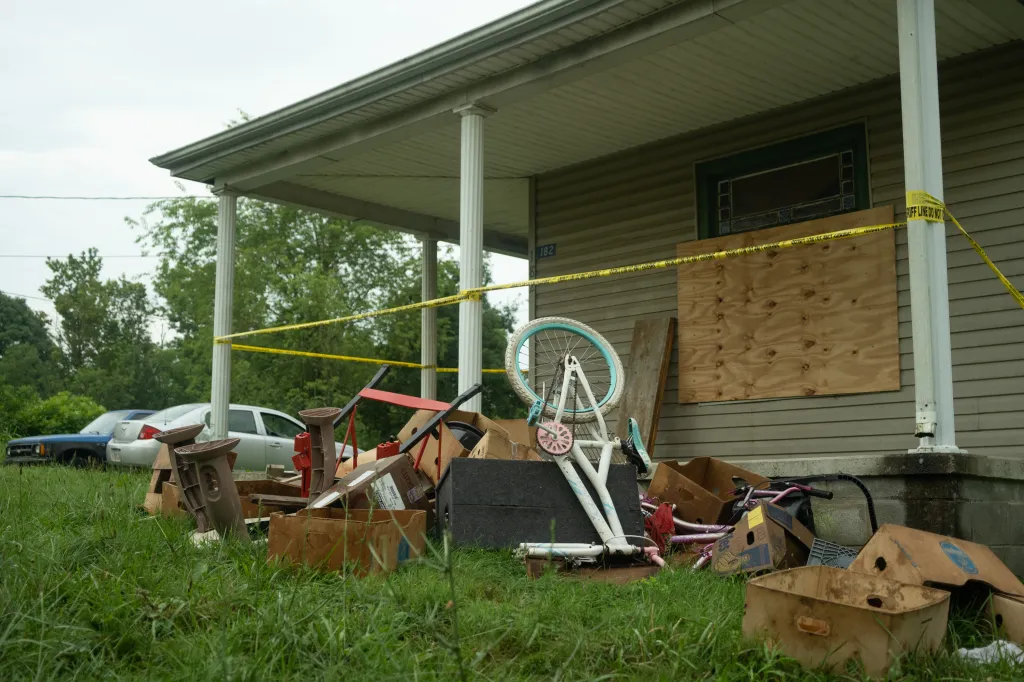 The front of the residence at 182 Ohmer St. in Hamden, Ohio, with caution tape and debris on the porch.