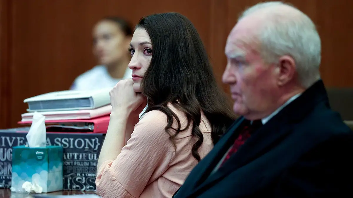 Lindsay Clancy and defense attorney Kevin Reddington listen to testimony in Plymouth Superior Court.