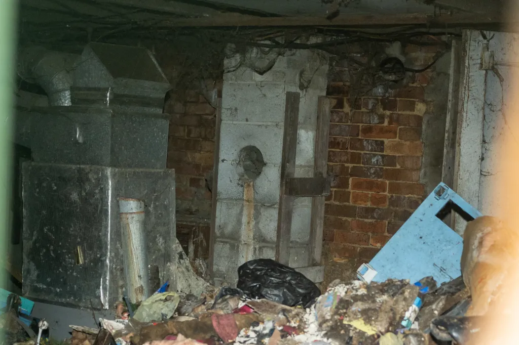 The interior of the Siders' home at 82 Ohmer St. in Hamden, Ohio, showing debris and unsanitary conditions.