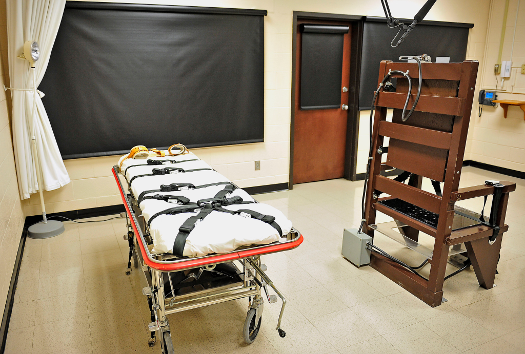 An execution gurney and an electric chair inside a death chamber at Riverbend Maximum Security Institution.