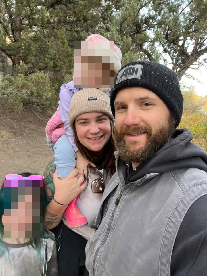 Kaylub and Kelsey Giamanco outdoors with their two daughters.