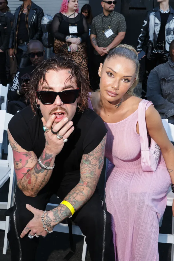 Mod Sun and Sahara Ray seated together at an event.