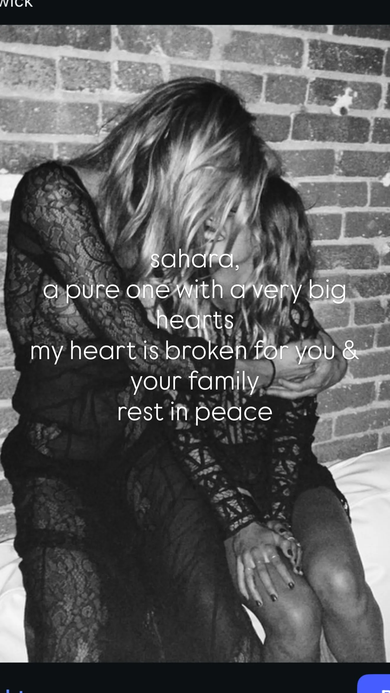 Black and white photo of two women hugging in front of a brick wall, with superimposed text expressing grief and condolences.