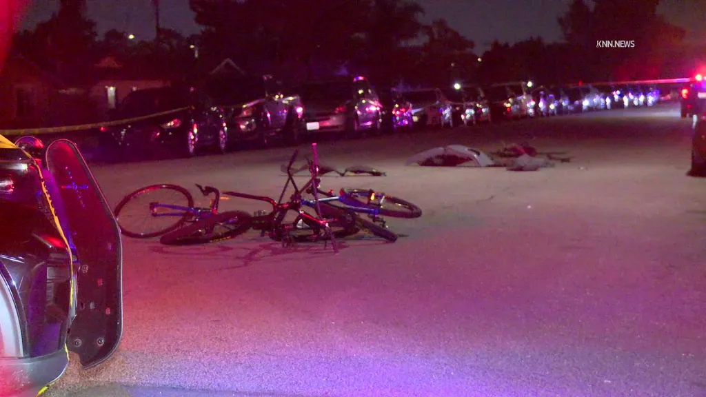 Damaged bicycles lie in the street at the scene of a fatal hit-and-run incident involving a vehicle and a group of bicyclists in Montclair.