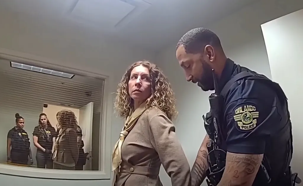 Police bodycam still of Irene Miller being arrested by an Orlando Police officer.