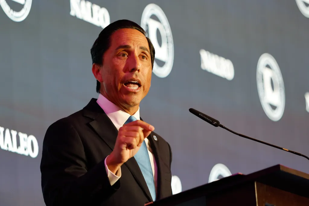 San Diego Mayor Todd Gloria speaks at a podium during the NALEO Annual Conference.